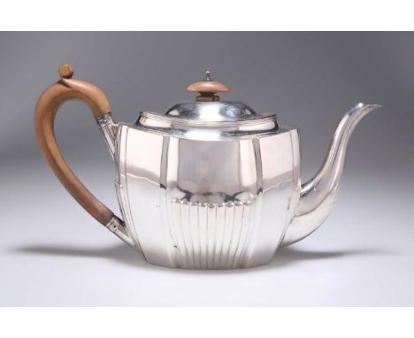 A GEORGE III SILVER TEAPOT by Robert Hennell I &amp; Samuel Hennell, London 1804, shaped oval, partially reeded, with wooden 