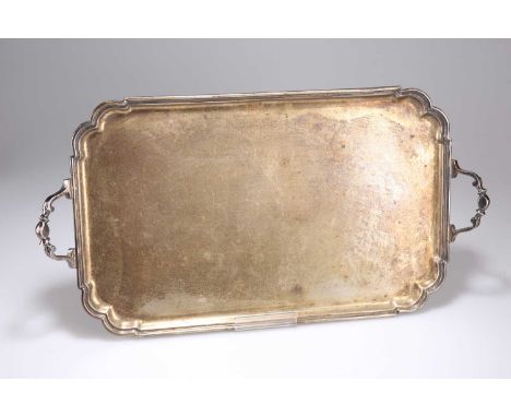 A GEORGE VI SILVER TWIN-HANDLED TRAY by Roberts &amp; Belk Ltd, Sheffield 1944, rectangular with shaped corners, with an ever