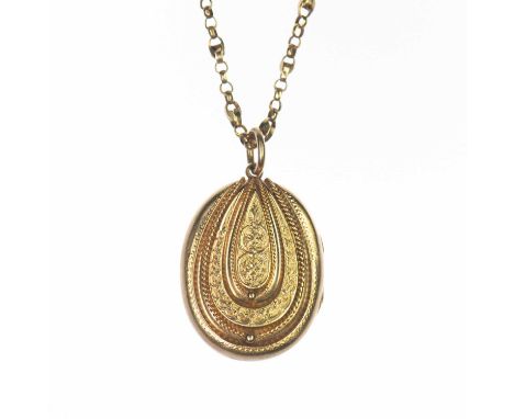 A VICTORIAN LOCKET PENDANT ON CHAIN an oval locket with rope and foliate engraved decoration, to a fancy curb link chain. Unm