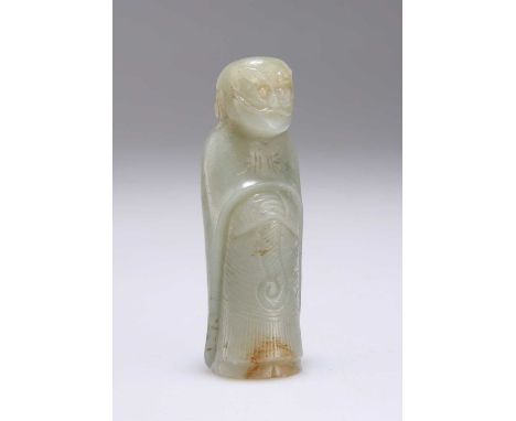 A CHINESE CARVED JADE TOGGLE WEIGHT depicting a wise man. 7.2cm high