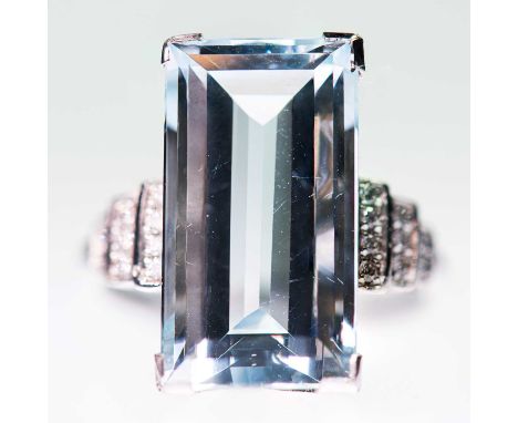 AN AQUAMARINE AND DIAMOND RING an octagonal-cut aquamarine to diamond-set stepped shoulders. Estimated total diamond weight 0