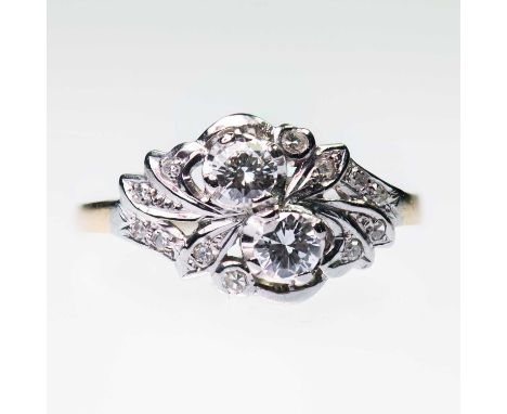 A DIAMOND RING two round brilliant-cut diamonds within diamond-set foliate shoulders. Estimated total diamond weight 0.45ct, 