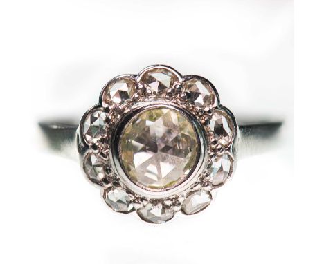 A ROSE-CUT DIAMOND CLUSTER RING a rose-cut diamond within a border of further rose-cut diamonds. Unmarked, ring size L1/2, 2.