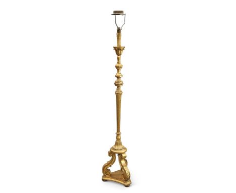 A 19TH CENTURY GILTWOOD STANDARD LAMP with a fluted and leaf-collared stem issuing from a tripod base. 179cm highNo breaks. A