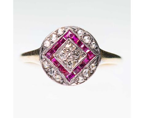 AN EARLY 20TH CENTURY RUBY AND DIAMOND RING the circular head milgrain-set with eight-cut and rose-cut diamonds and calibré-c