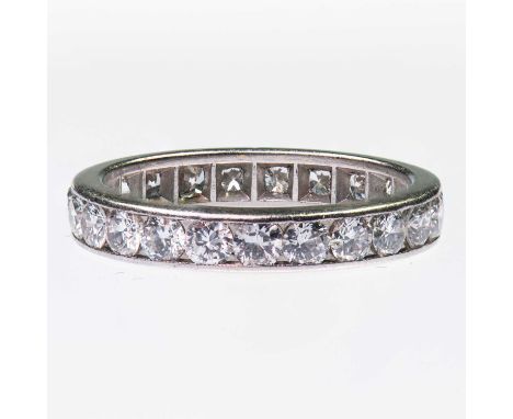 A DIAMOND ETERNITY RING channel-set round brilliant-cut diamonds to a flat band. Estimated total diamond weight 1.85ct, unmar