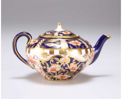 A ROYAL CROWN DERBY IMARI PATTERN MINIATURE TEAPOT early 20th Century, red printed factory mark. 9.5cm long