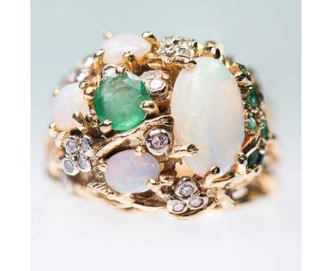 AN 18 CARAT GOLD OPAL, EMERALD AND DIAMOND RING the heavily textured bezel set with oval opals, round-cut emeralds and eight-