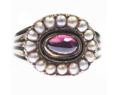 A GEORGIAN GARNET AND SEED PEARL MOURNING RING an oval cabochon garnet within a border of black enamel and seed pearls, to a 