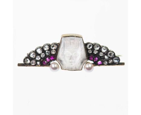 AN EARLY 20TH CENTURY EGYPTIAN REVIVAL MOONSTONE, DIAMOND, RUBY AND PEARL BROOCH a carved moonstone depicting the head of a p