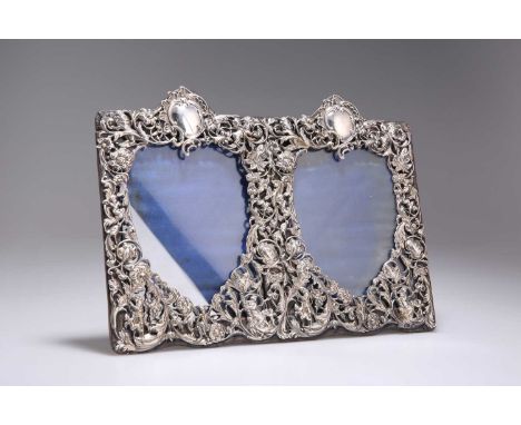 A VICTORIAN SILVER-MOUNTED DOUBLE PHOTOGRAPH FRAME by William Comyns &amp; Sons, London 1891, rectangular, pierced and chased