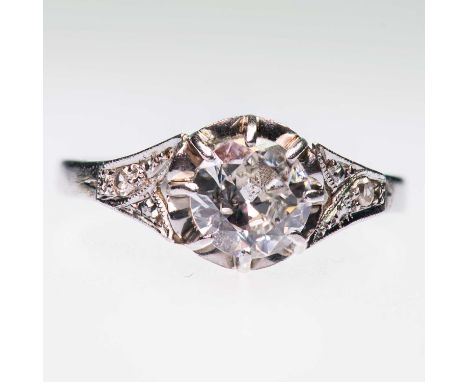 AN EARLY 20TH CENTURY SOLITAIRE OLD-CUT DIAMOND RING an old-cut diamond in an extended claw setting to fancy milgrain diamond