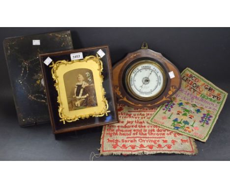 An Edwardian marquetry barometer, shaped mount, c.1900 (faults); two 20th century samplers; a 19th century cabinet photograph