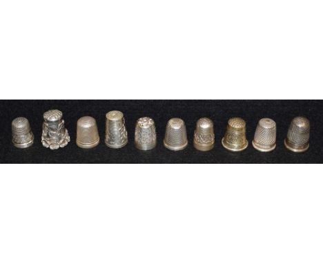 A silver thimble, Birmingham 1928; other silver thimbles, Dorcas sterling silver, 925; silver coloured metal thimbles; etc (1