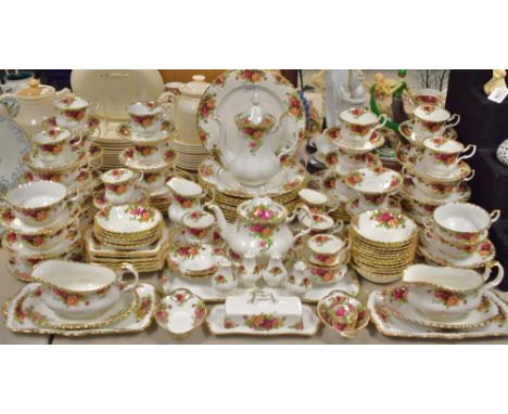 A Royal Albert Old Country Roses dinner service comprising plates, side plates, cups and saucers, tea pot, coffee pot, sauce 