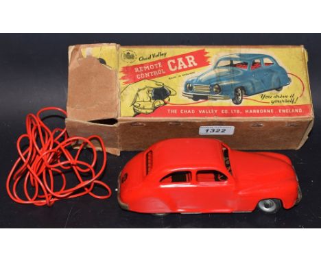 A vintage Chad Valley clockwork remote control car, red body, rubber tyres, boxed 