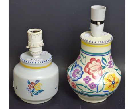 A Poole pottery floral decorated table lamp;  another (2)