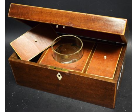 An early 19th century mahogany rectangular tea caddy, outlined with boxwood stringing, three interior sections with glass mix