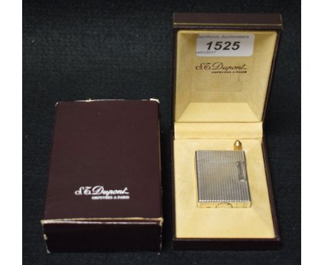 Tobaccania - an S J Dupont Ligne 1 diamond head pocket lighter, serial No 85CCK35, cased and boxed, original instructions and