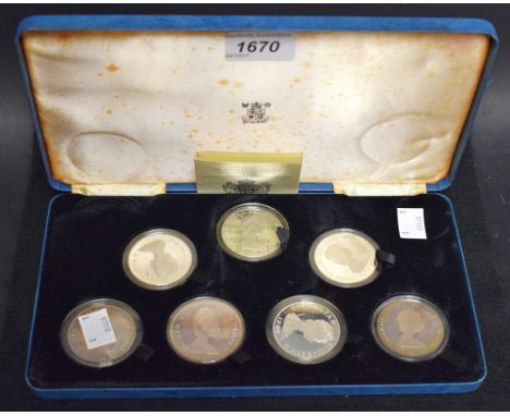 A set of seven sterling silver proof coins, The Queen Mother 80th birthday, cased 