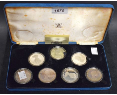 A set of seven sterling silver proof coins, The Queen Mother 80th birthday, cased 