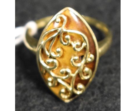 An tigers eye dress ring, navette tigers eye wrapped within a floral scrolling crest and plain surround, 9ct gold shank, size