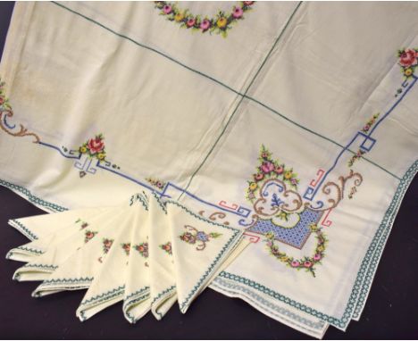 Textiles - a 1920s hand embroidered table cloth, 84 x 66 inches, with eight matching napkins (7)