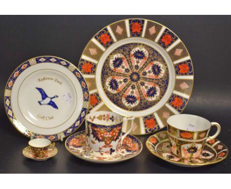 A Royal Crown Derby 1128 Imari dessert plate, first quality; a conforming tea cup and saucer, second quality; a Royal Crown D