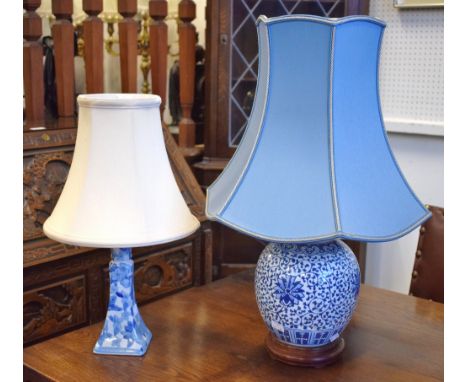 Two ceramic blue and white lamp bases with shades