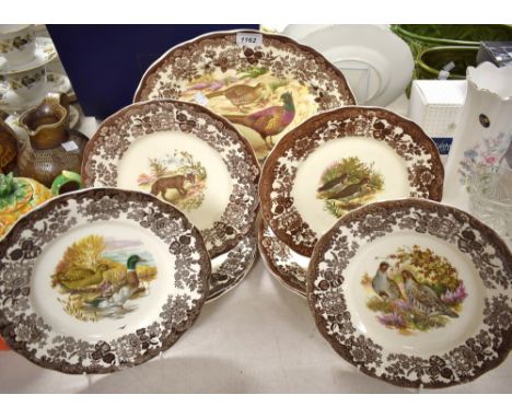 A Royal Worcester Palissy Game Series oval serving platter, transfer printed with pheasants in sepia tones, a set of shaped c