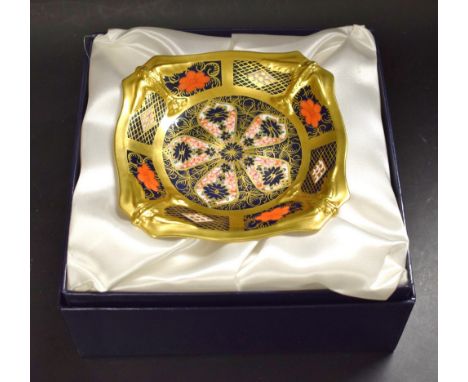 A Royal Crown Derby 1128 pattern shaped square pedestal comport, with solid gold band and birds in flight to angles, 14cm wid