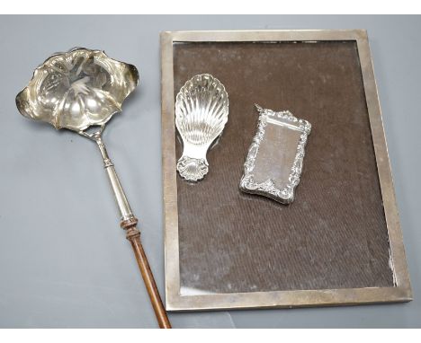 A Georgian style silver toddy ladle, London 1976, a silver mounted rectangular photograph frame, a caddy spoon, and a vesta c