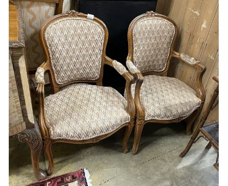 A pair of Louis XV style beech fauteuil, with a tapestry upholstered seat and back, width 55cm, depth 48cm, height 90cm