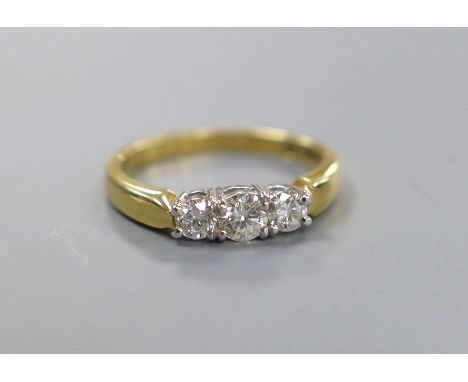 A modern 18ct gold and plat, three stone diamond set ring, size M, gross weight 4.1 grams, total diamond weight approx. 0.53c