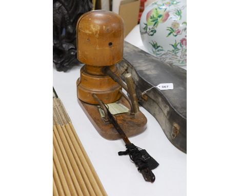 A milliner's hat stretcher and lorgnette