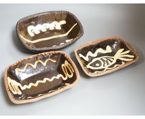 Winchcombe pottery, three press moulded slipware dishes, one with Ray Finch maker’s stamp, largest 26.5cm wide Provenance - B