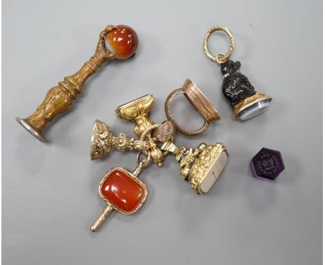 Eight assorted 19th century and later fob seals including a rose diamond set black glass dog with Roman head intaglio, 3cm, a