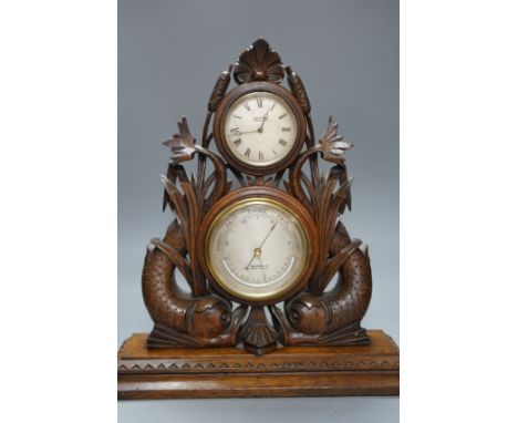 A Victorian oak timepiece combined barometer by Salom &amp; Co., carved with stylised fish and bull rushes, height 46cm