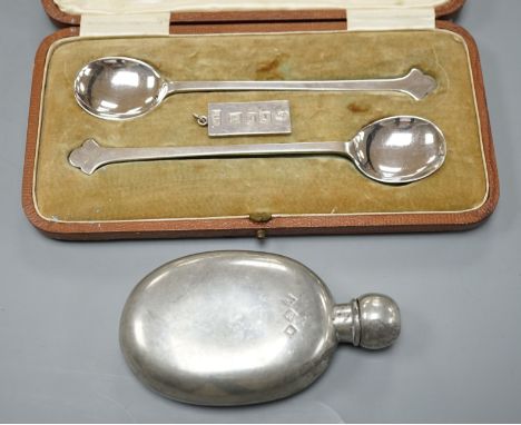 A cased pair of George V silver preserve spoons, Sheffield 1911, 36 grams, an ingot pendant, 15 grams and a pewter pocket fla