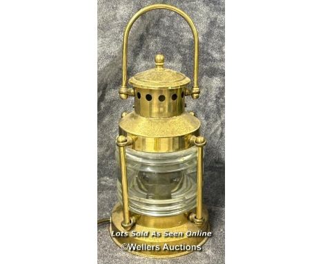 A small brass ships lantern converted to electricity, in working order with a very short power lead, 32cm high / AN12 