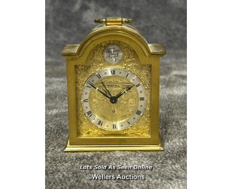 A small brass alarm clock by Swiza, 9.5cm high / AN35 