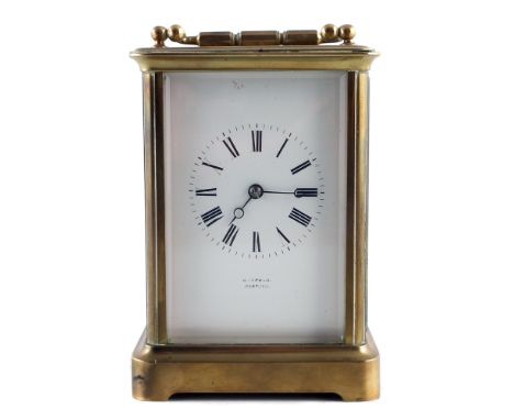 Late 19th century brass framed carriage clock, white enamel dial, 8-day movement striking on single gong, height 15cm (6"). F