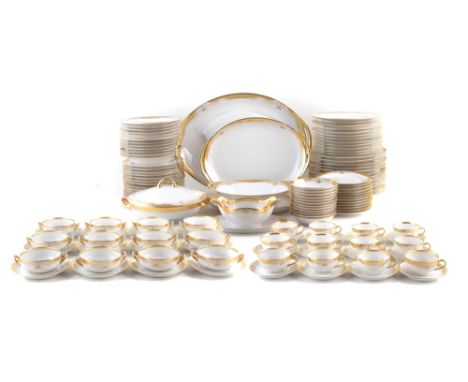 Limoges dinner service gilded by Josephine. Angelic Veith, to include three graduated oval plates, sauceboat, oval tureen, li