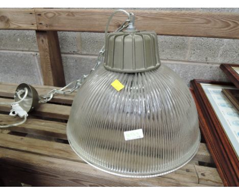 A vintage ceiling light of industrial form