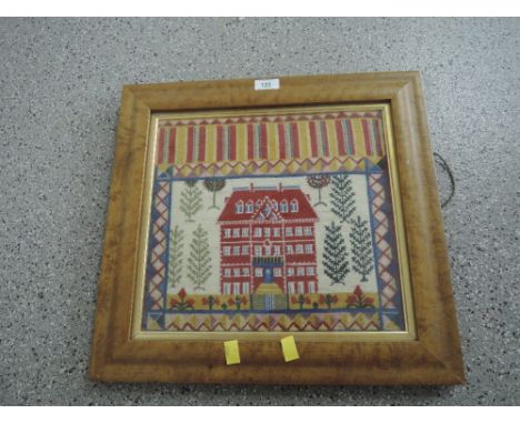 A vintage tapestry needle work embroidery depicting a maison style mannor house