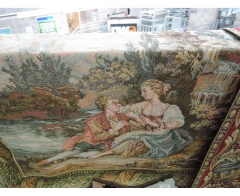A sewn tapestry wall hanging depicting regency style scene of two lovers courting