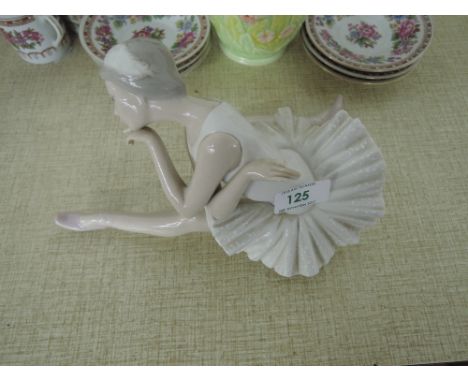 A Lladro ceramic figure of a ballerina 