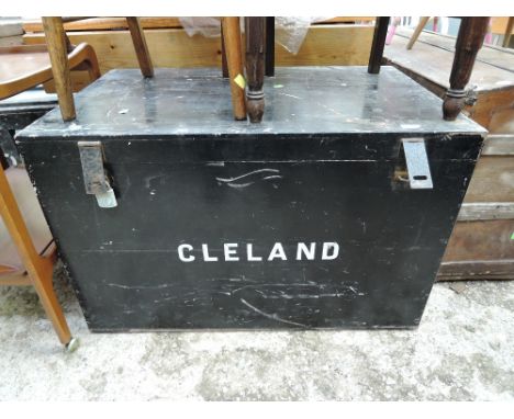 A vintage black painted wooden storage/travel trunk