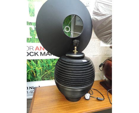 A modern table lamp, of stylised form
