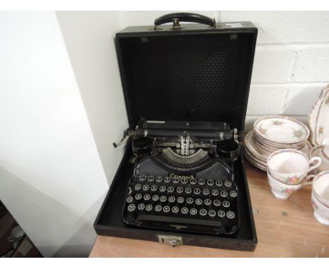 A vintage typewriter made by Carona black cast body with large keys